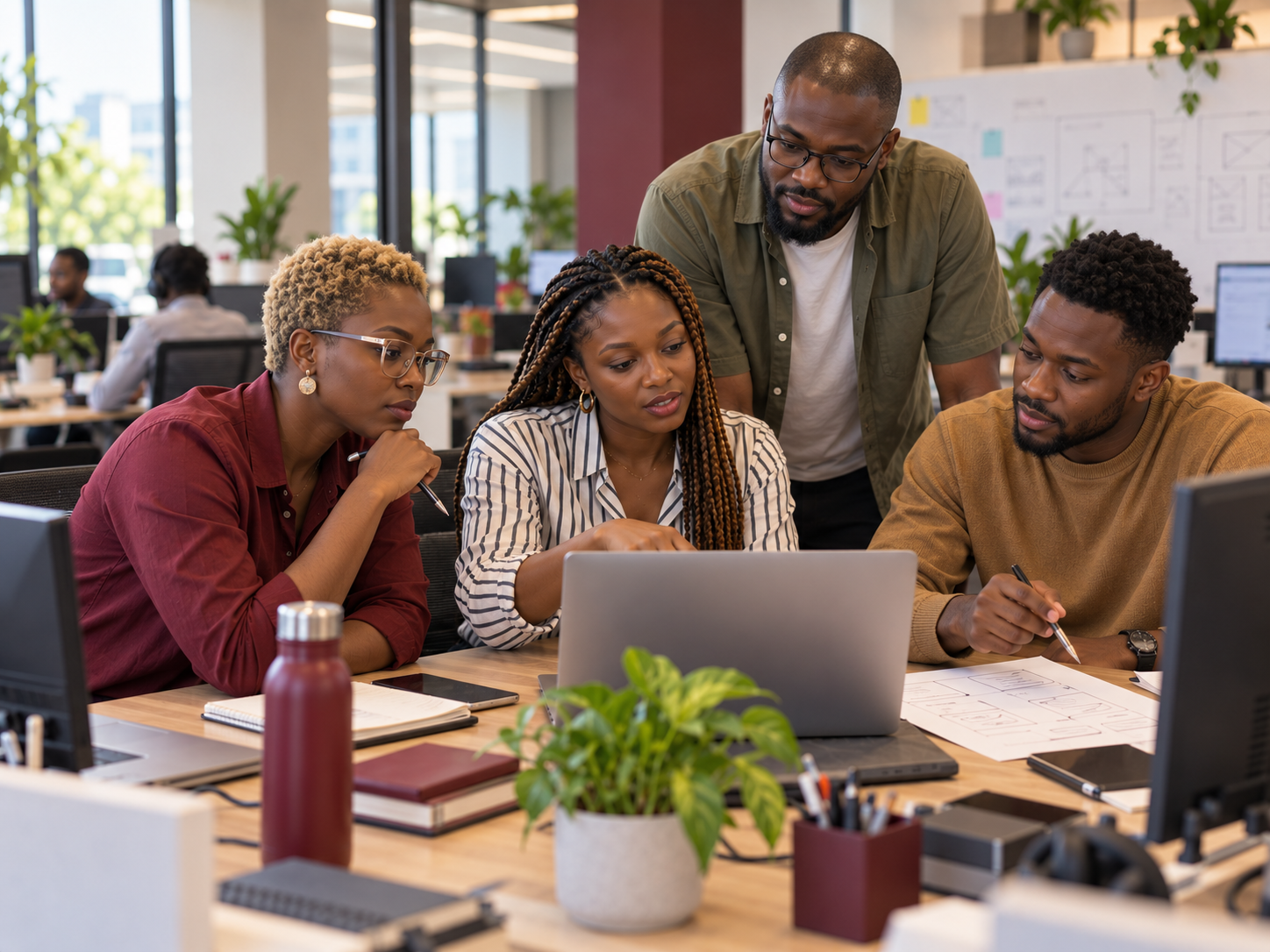 A modern technology hiring team in Accra collaborating on recruitment and team planning